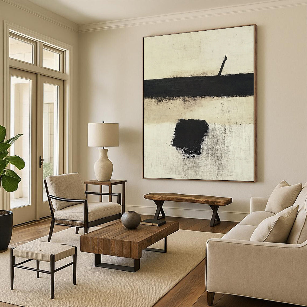 Contemporary hand-painted abstract art featuring a white background with bold black and beige hues and a striking central brush stroke. DLZ0424