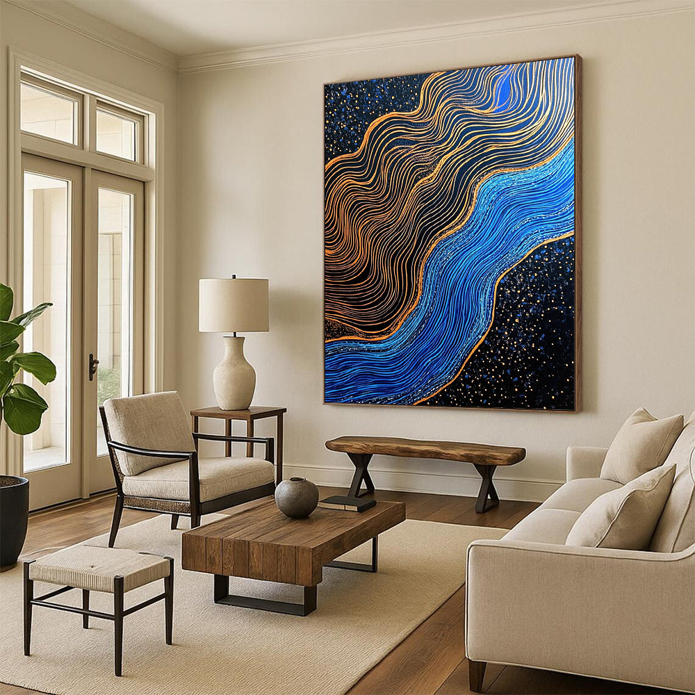 Contemporary hand-painted abstraction featuring blue and gold contrasts with gilded lines over a dark blue river in a black sand desert. DLZ1561