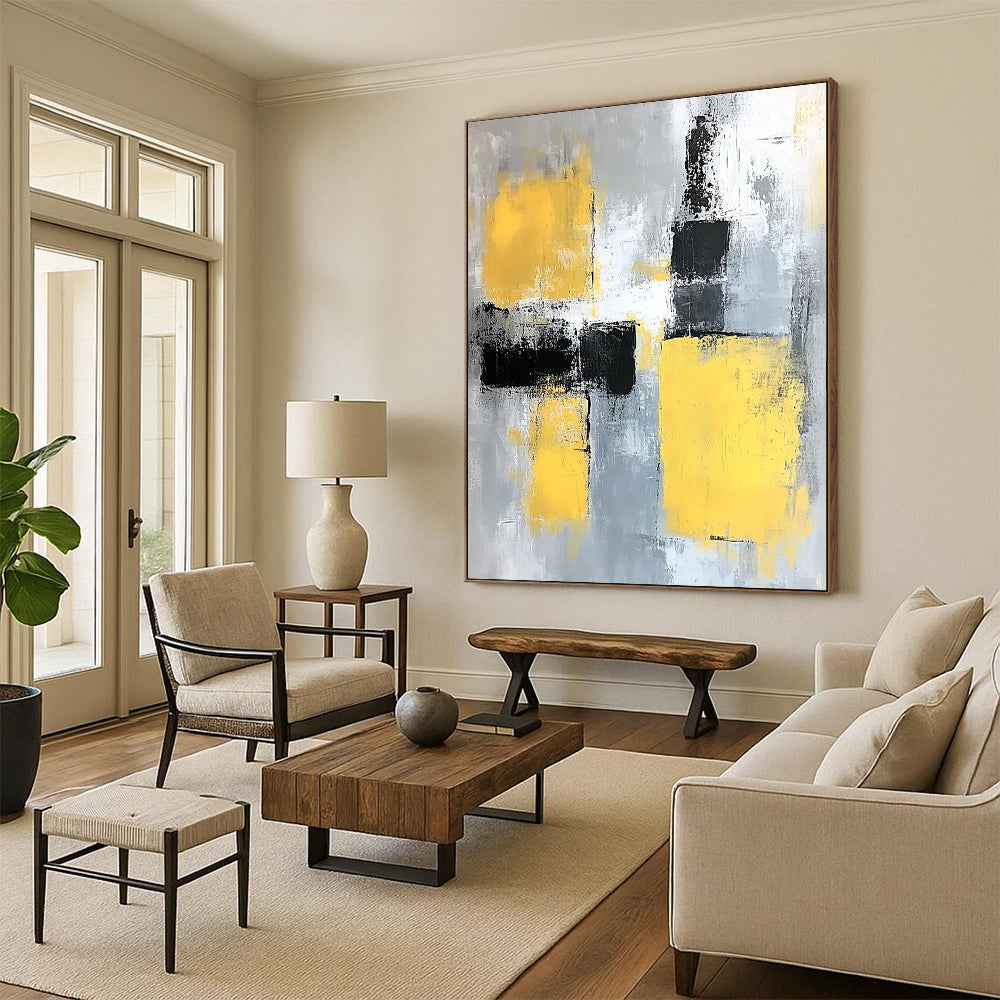Contemporary abstract painting featuring gray and yellow color blocks with soft edges and dynamic brush strokes on a large canvas. DLZ0522