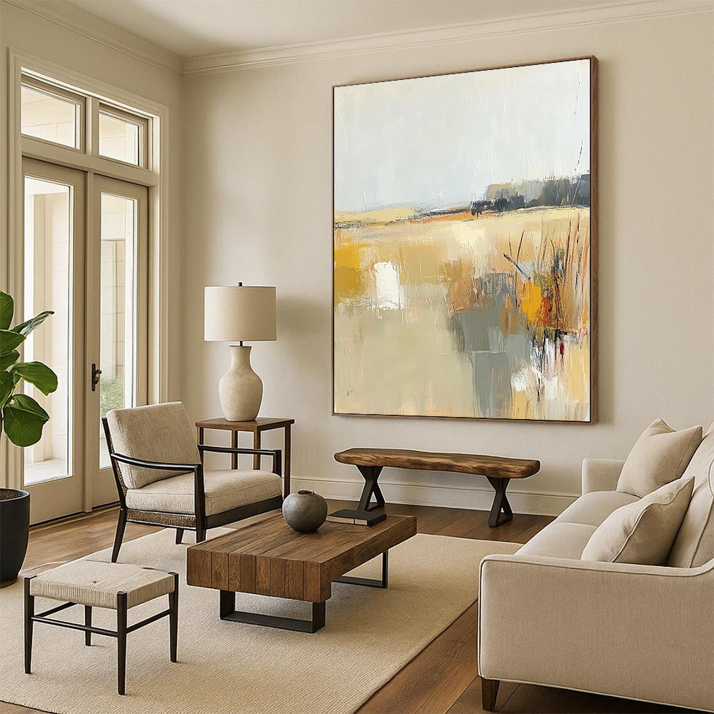Contemporary abstract painting showcasing soft beige and gray tones with touches of yellow, illustrating the tranquil essence of a field beneath a light sky. DLZ0416