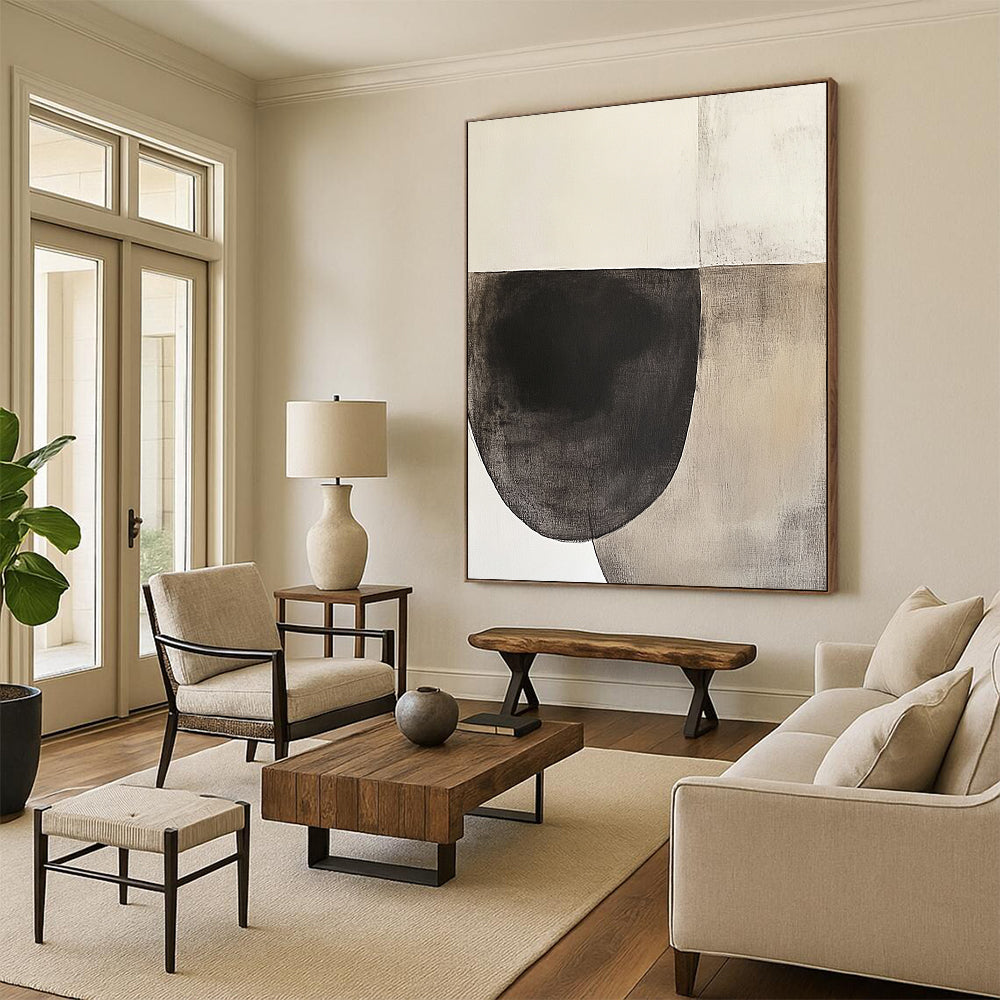 Contemporary hand-painted abstract artwork featuring an oval shape in dark charcoal and beige tones on textured white paper, inspired by minimalist design. DLZ0965