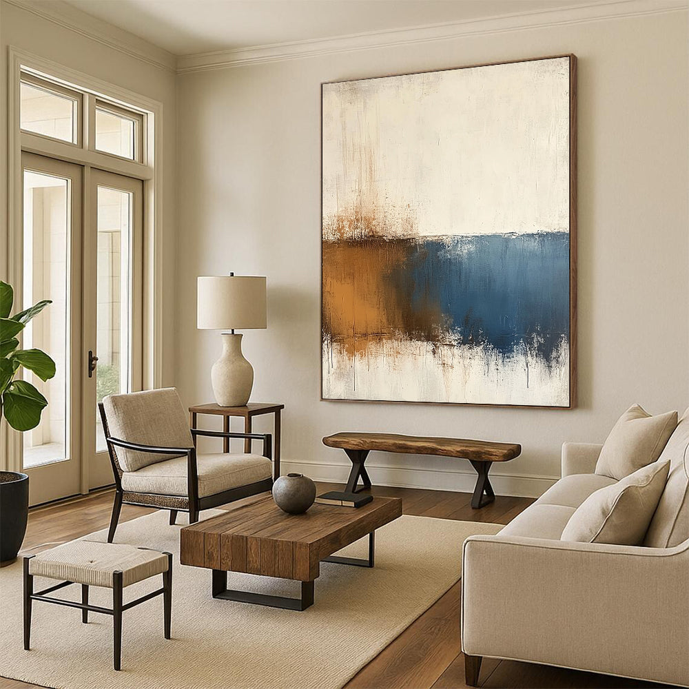 Contemporary hand-painted abstract art features beige and blue tones on a textured white background with minimalist soft edges and subtle brown accents. DLZ0725