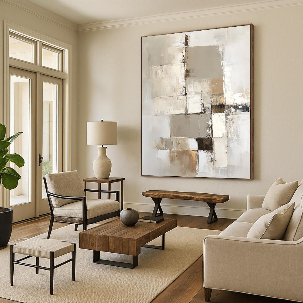 Large contemporary abstract painting with a beige and white palette showcasing geometric shapes and textures on a vertical canvas. DLZ0697