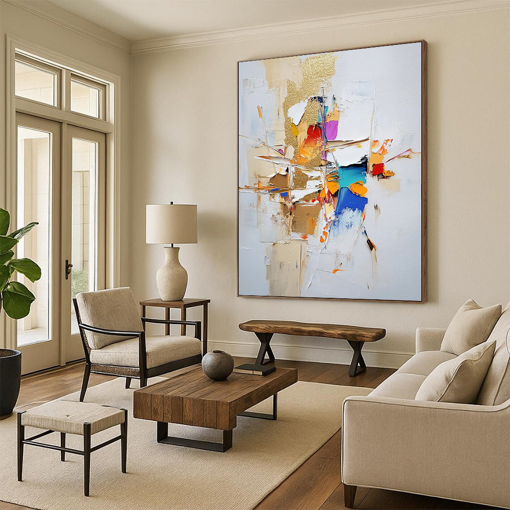 Contemporary large abstract painting featuring gold leaf and textured strokes in neutral tones with vibrant accents on a white background. DLZ0744