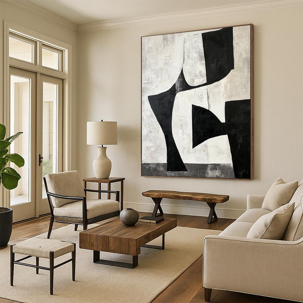 Contemporary hand-painted abstract artwork featuring black and white shapes creating negative space resembling legs against a gray-toned background. DLZ1392