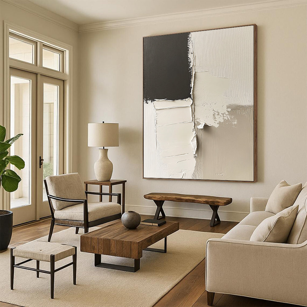 Contemporary abstract artwork features striking black and white impasto shapes and minimalist lines on a canvas with deconstructed paper elements in neutral tones. DLZ0524