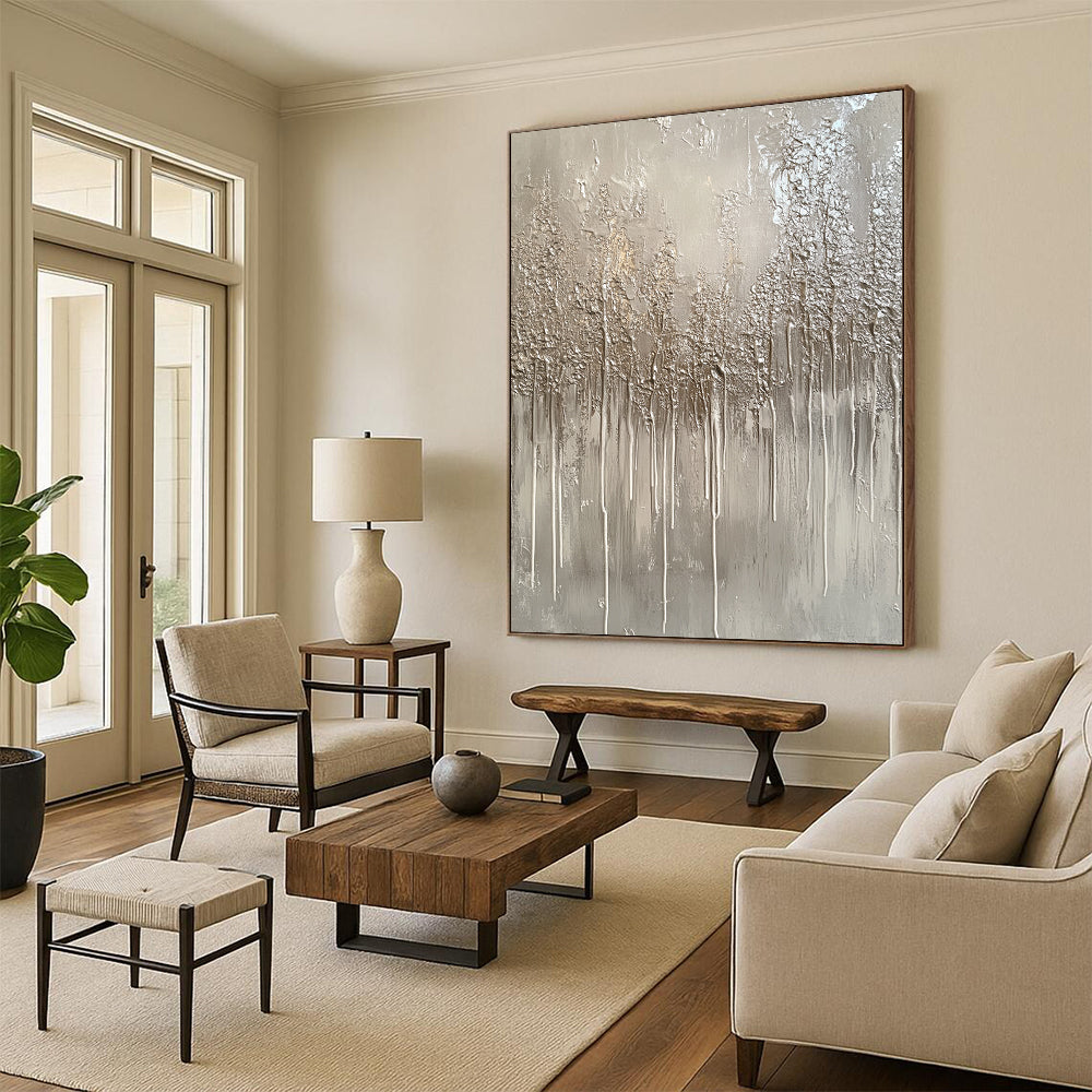 Large contemporary hand-painted abstract artwork featuring a monochromatic gray palette with drips and metallic silver accents evoking winter landscapes. DLZ1517