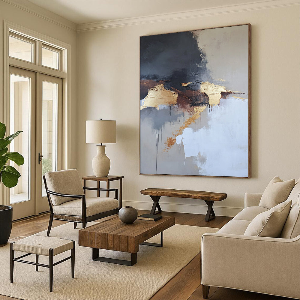 Contemporary abstract painting features aerial views with dark gray and white clouds gold elements in beige tones and thick brush strokes. DLZ0448