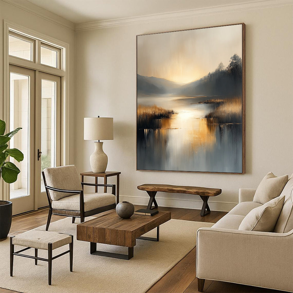 Contemporary abstract painting with soft gray and beige tones reflecting on water evokes serenity in a large canvas illuminated by golden hour light. DLZ0417