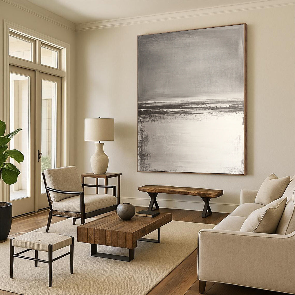 Contemporary hand-painted abstract artwork features neutral tones with gray and white, textured water reflections, and soft brush strokes for a serene beach landscape. DLZ0390
