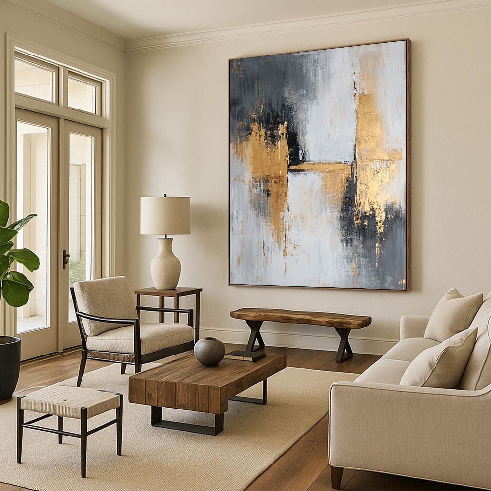 Large contemporary abstract painting featuring gray and gold tones with textured brush strokes that evoke calmness and tranquility on a spacious canvas. DLZ0709