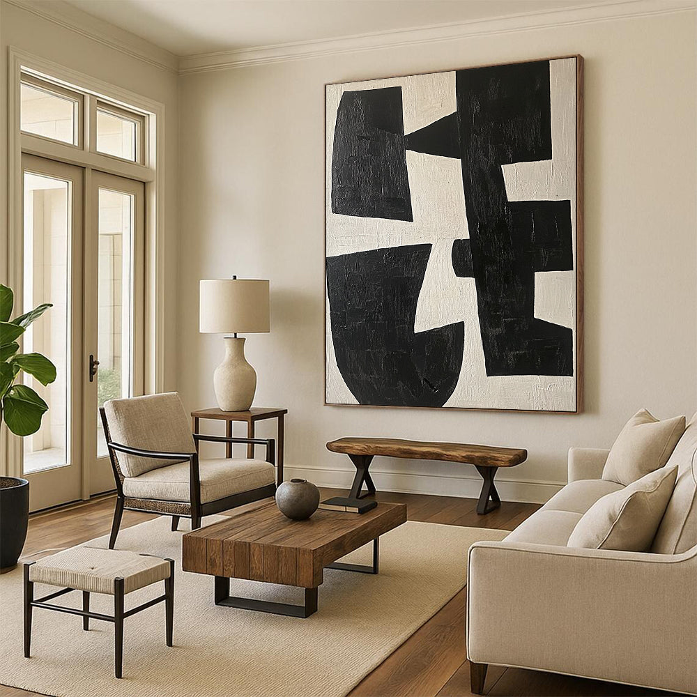 Large contemporary abstract painting featuring black and white shapes on a light beige background highlighting geometric forms and elegant movement. DLZ0509