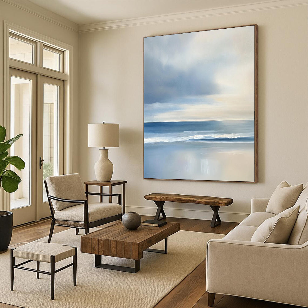 Contemporary abstract artwork features a serene ocean with gentle waves and soft clouds, showcasing light blues and grey tones for a tranquil ambiance. DLZ1460