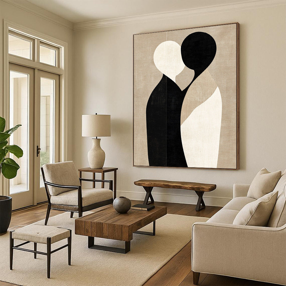 Large contemporary abstract art featuring minimalist shapes in black and beige, embracing forms on a textured light brown background. DLZ1464