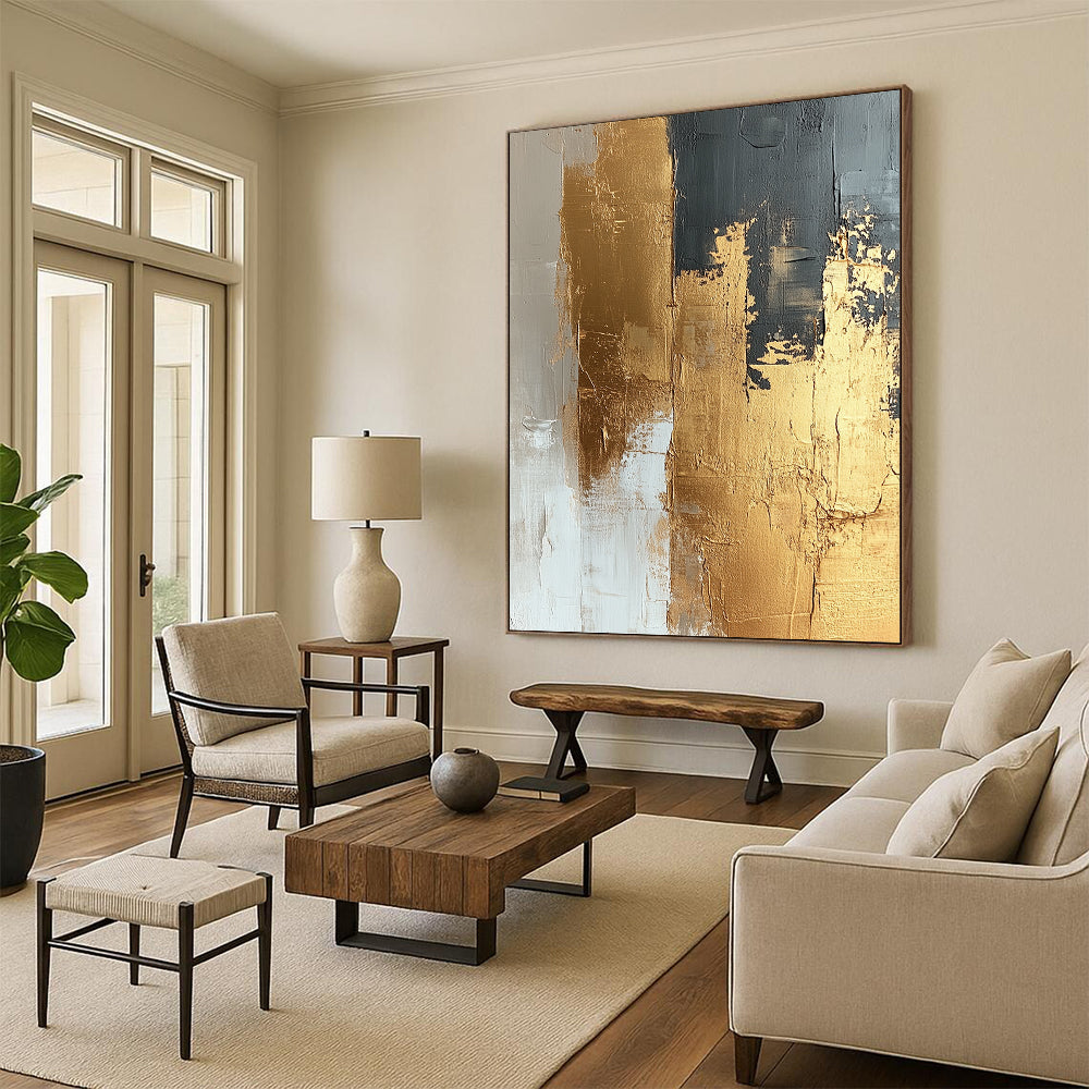 Contemporary abstract painting featuring textured gold foil on a beige and white canvas showcasing dynamic brushstrokes and a refined neutral palette. DLZ1019