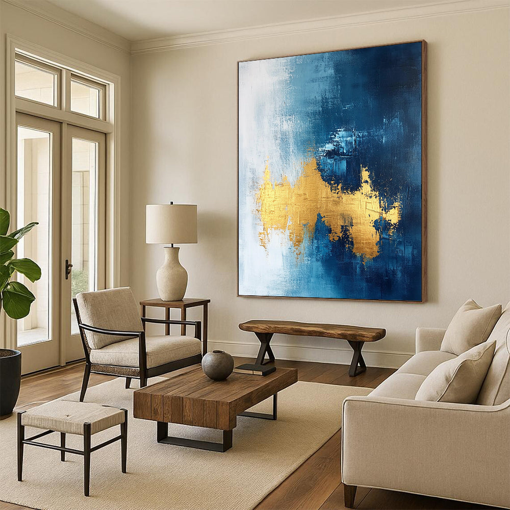 Contemporary abstract painting features gold leafing on a dark blue white and light gray background with elegant brush strokes and a sophisticated texture. DLZ0334