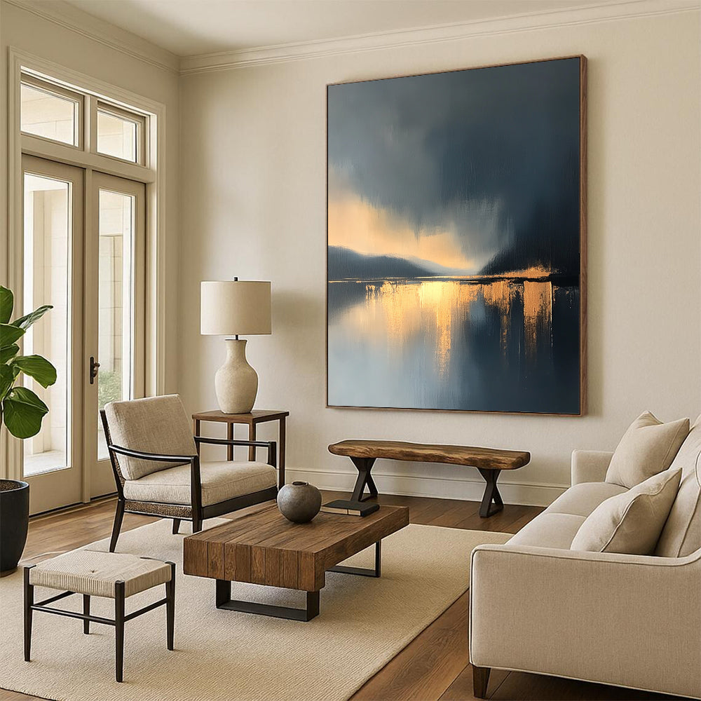 Large contemporary abstract painting features a lake and sky with golden light reflections and atmospheric clouds in minimalist modern art style. DLZ0470