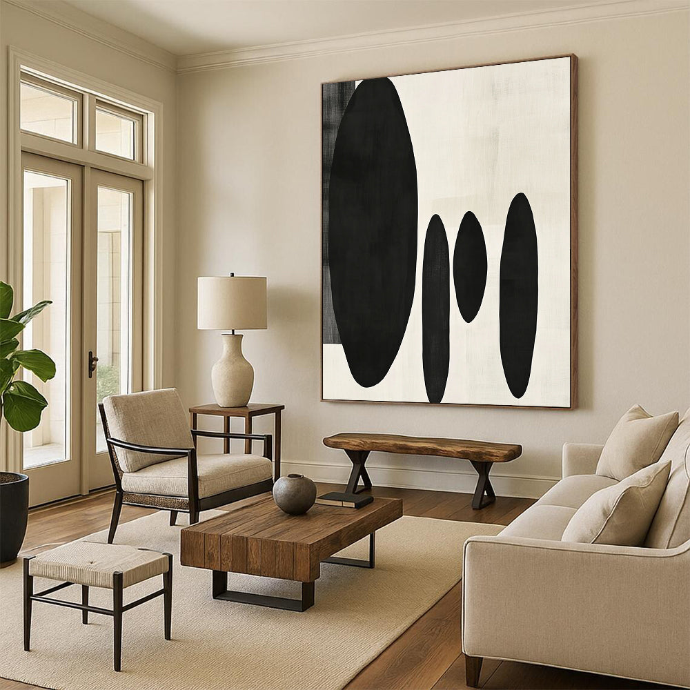 Contemporary minimalist artwork featuring organic black shapes balancing large forms on the left with delicate smaller shapes on the right. DLZ1547