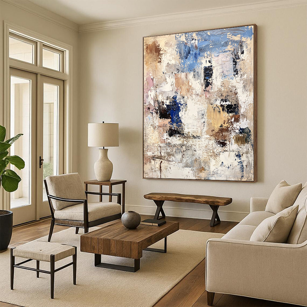 Contemporary abstract artwork showcasing textured white rocks and buildings with bold brushstrokes in beige, brown, blue, and gray. DLZ0898