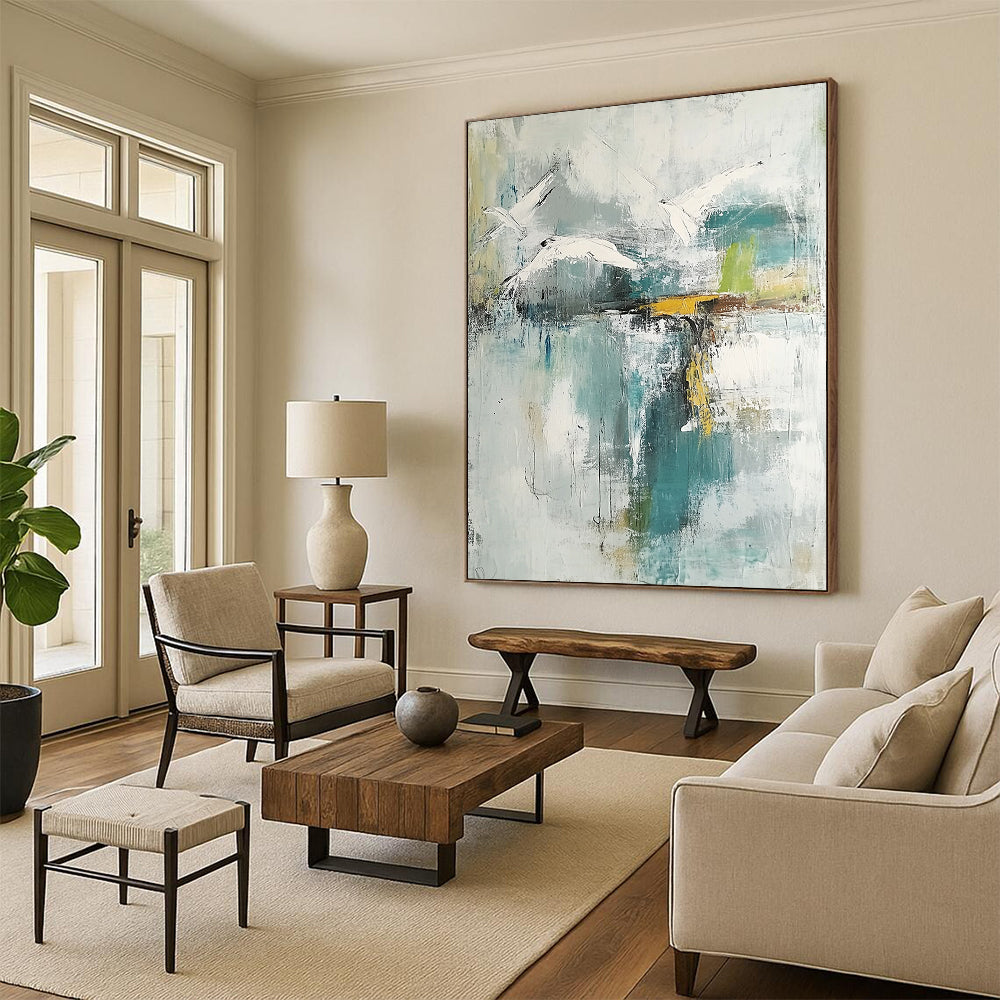 Contemporary hand-painted abstract artwork features neutral hues with teal and gold accents soft watercolors evoke birds over a lake with serene reflections. DLZ0758