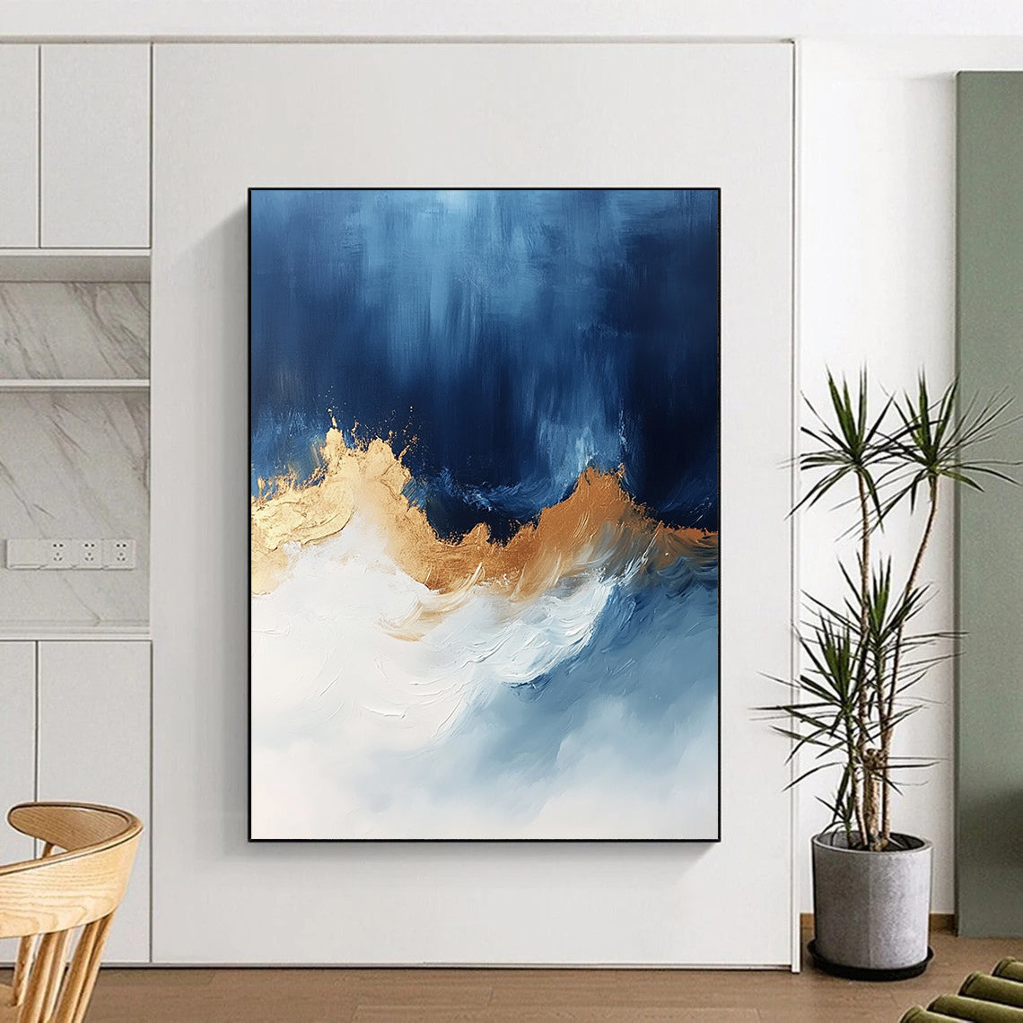 Contemporary abstract art features bold blue white and gold hues with sweeping brushstrokes energizing the canvas creating depth and visual allure. DLZ0335