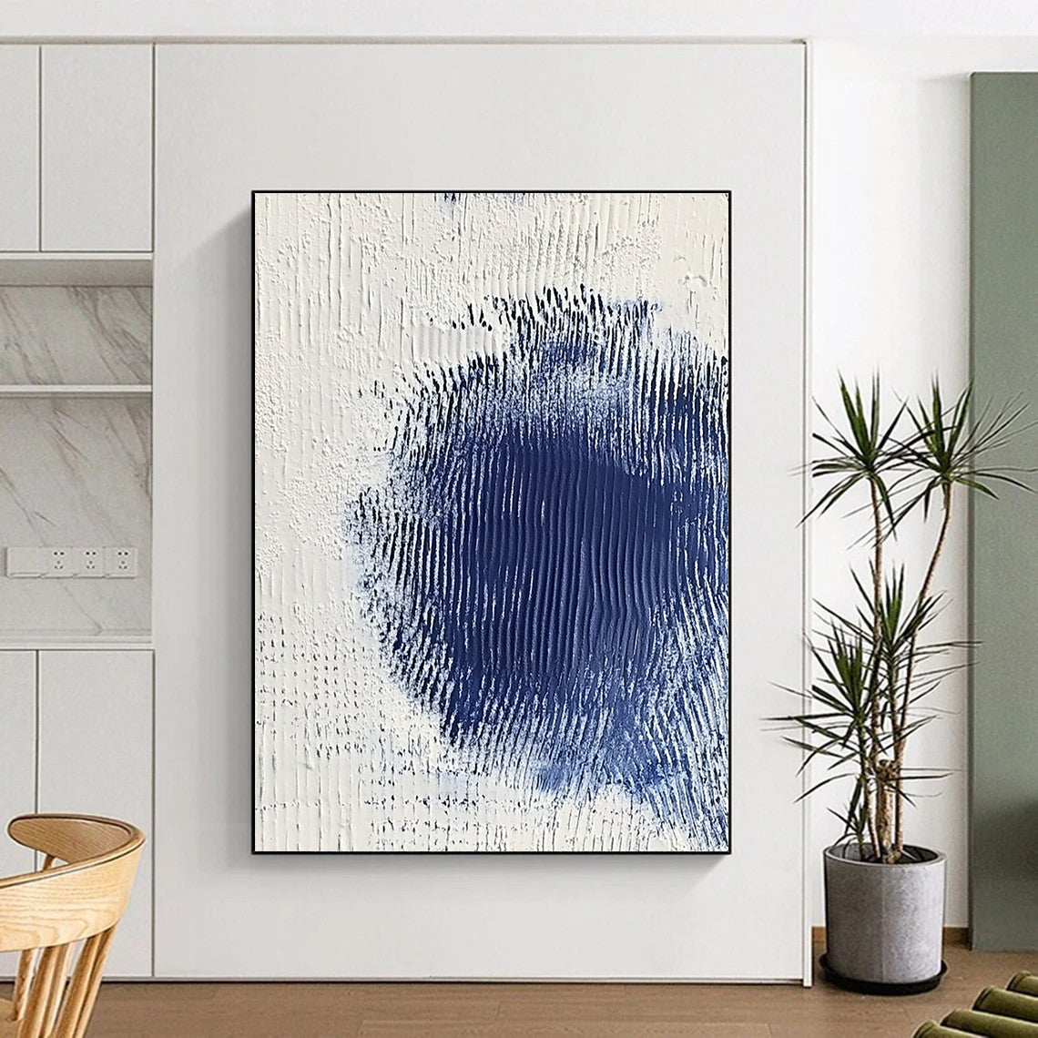 Contemporary abstract art featuring serene white and blue textures with a central dark blue spot creating depth and minimalistic elegance. DLZ1223
