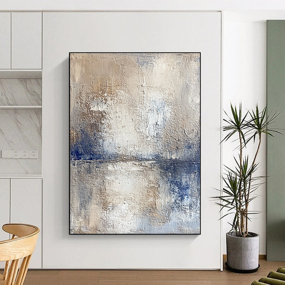 Contemporary hand-painted abstract artwork depicting a serene lake and sky with textured beige tones and vibrant blue accents for a striking visual experience. DLZ0471