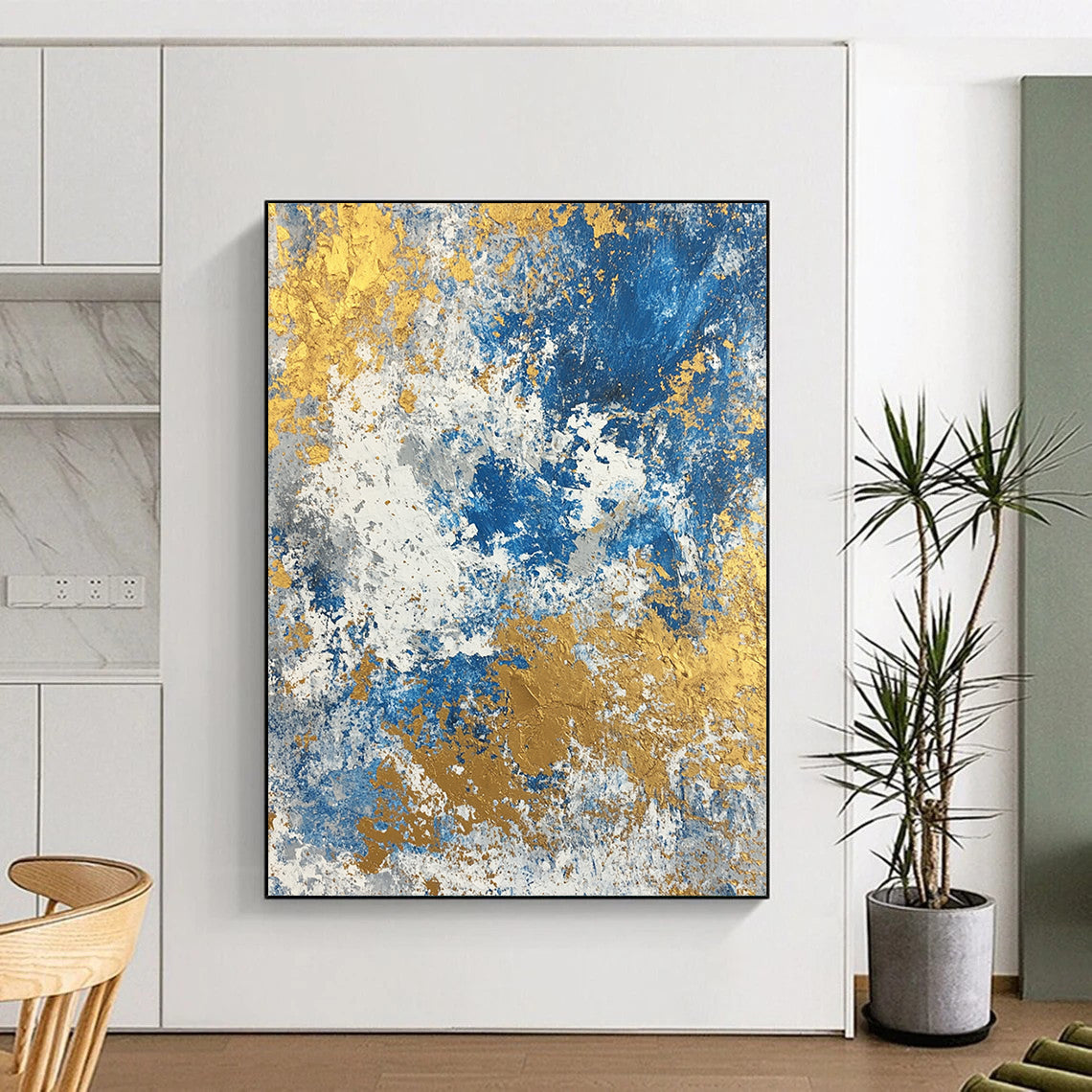 Large contemporary abstract painting featuring a textured blend of blue gold beige white and silver colors. Perfect for modern decor. DLZ0339