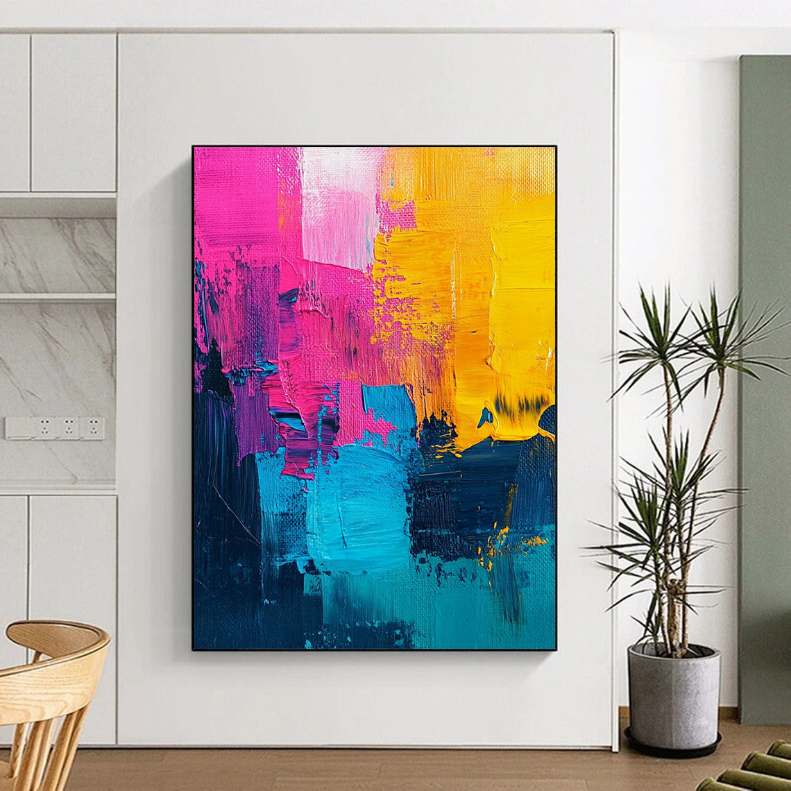 Vibrant contemporary abstract painting with bold pink and yellow accents, a striking turquoise center, and rich dark blue features, showcasing textured acrylic brush strokes. DLZ0776