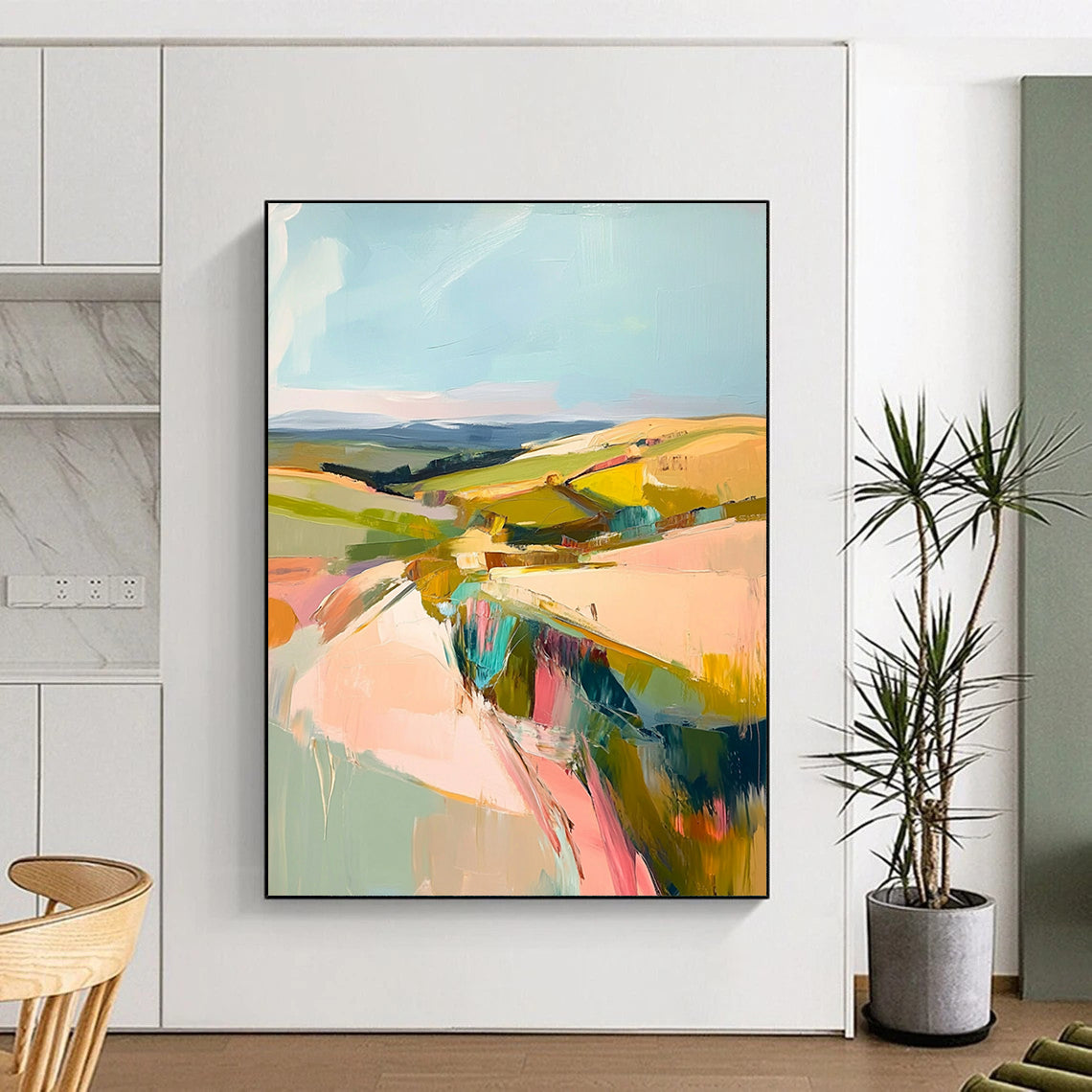 Large contemporary abstract painting featuring a pastel palette of pinks greens and yellows capturing the beauty of Welsh rolling hills and blue skies. DLZ1003