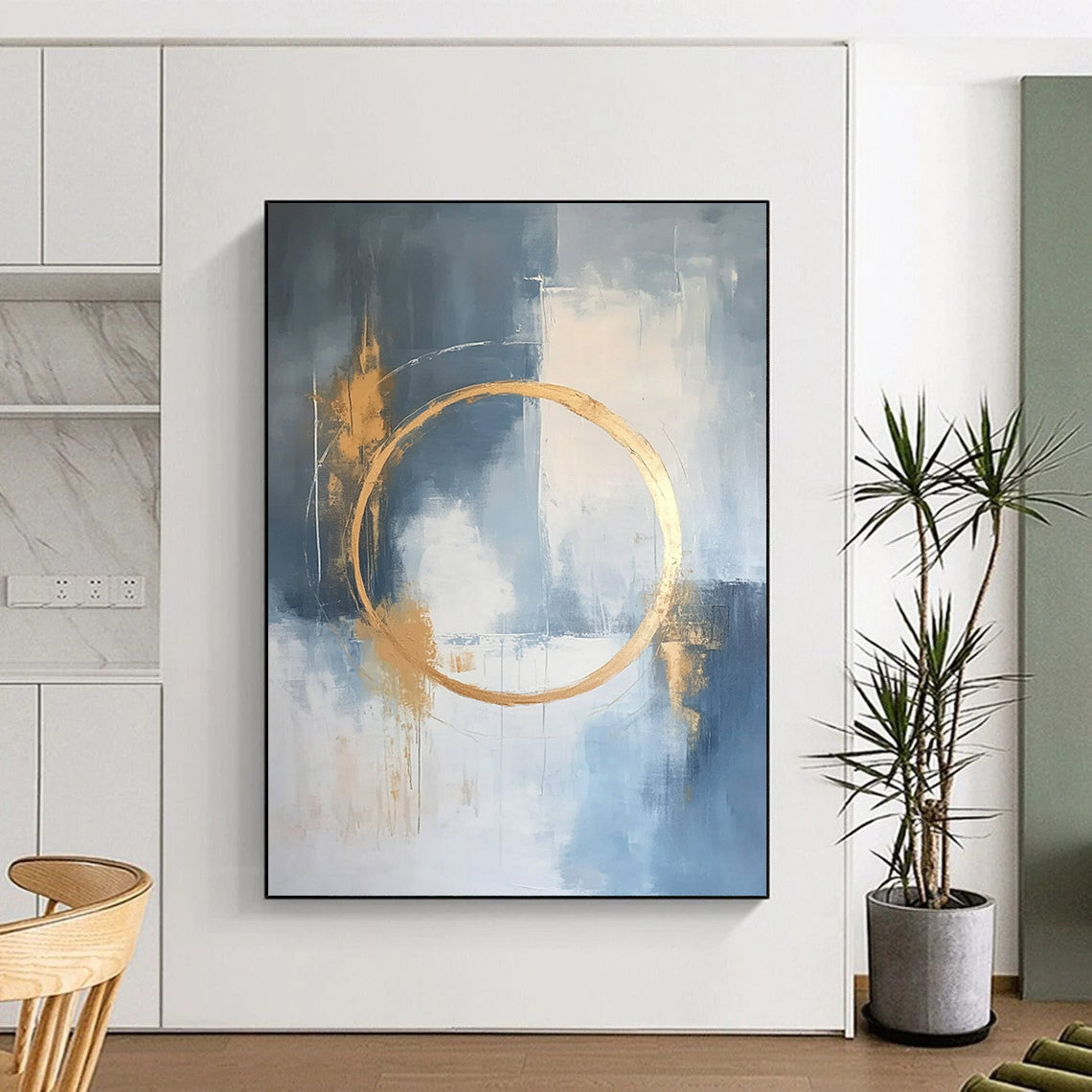 Large contemporary abstract painting features a light blue and white background with gold accents and elegant lines for a high-end aesthetic. DLZ0545