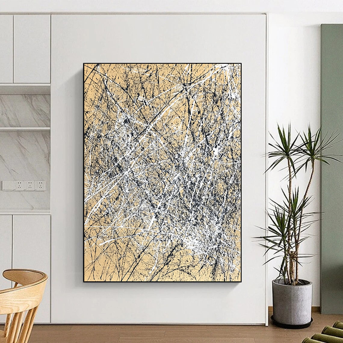 Contemporary hand-painted abstract artwork features dynamic brush strokes and expressive composition in white and black against a light brown background. DLZ1162