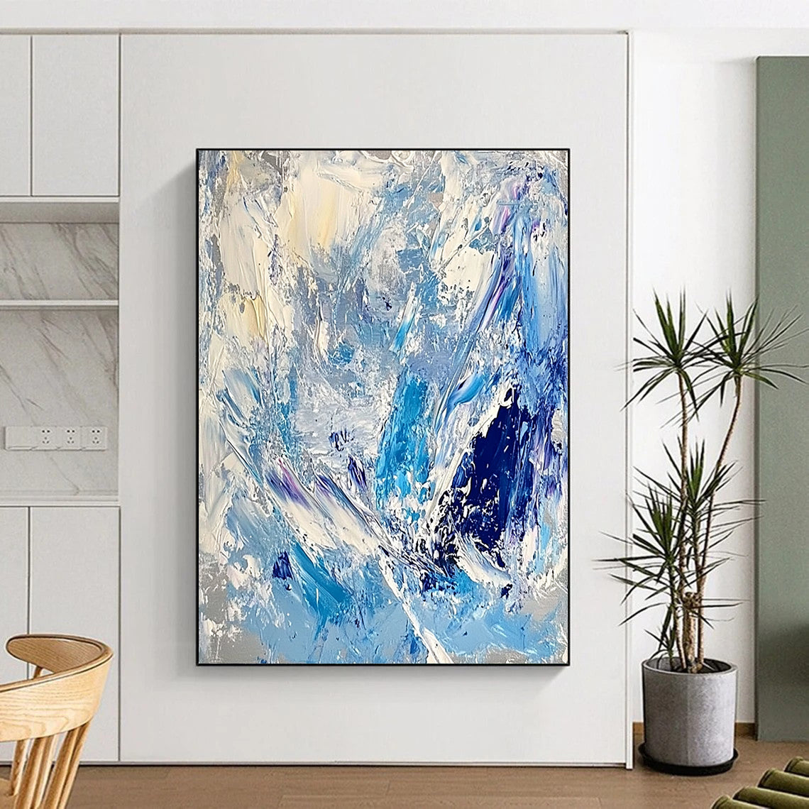 Contemporary large abstract artwork featuring thick impasto strokes in light blue, white, and silver, evoking the essence of ice and snow. DLZ0624