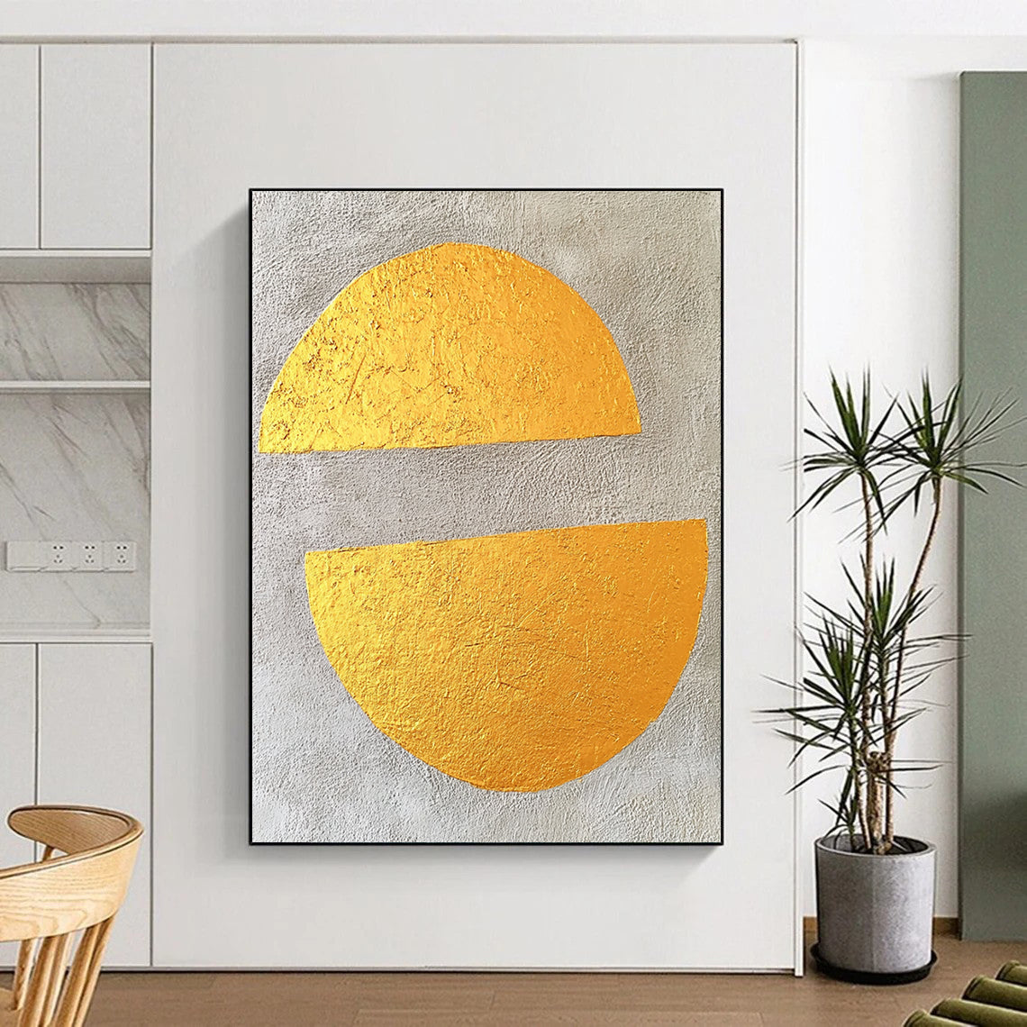 Contemporary abstract art featuring gold leaf on gray concrete with two large flat semicircles, creating a minimalist and striking visual experience. DLZ1579