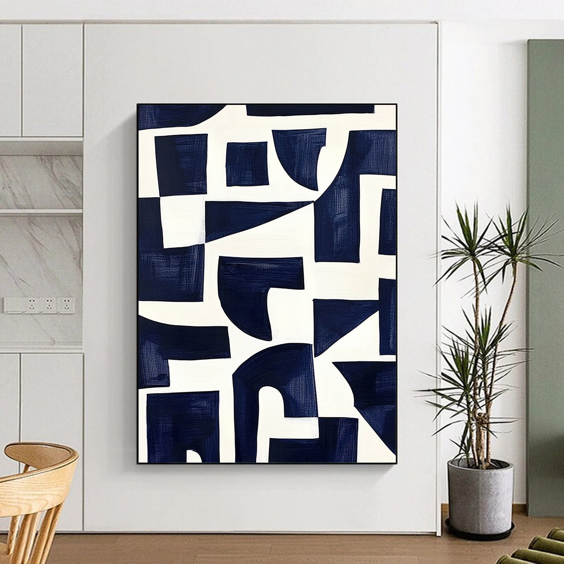 Contemporary hand-painted abstract art features navy blue shapes on a white background inspired by Matisse's cutouts with dark indigo and off-white accents. DLZ1430