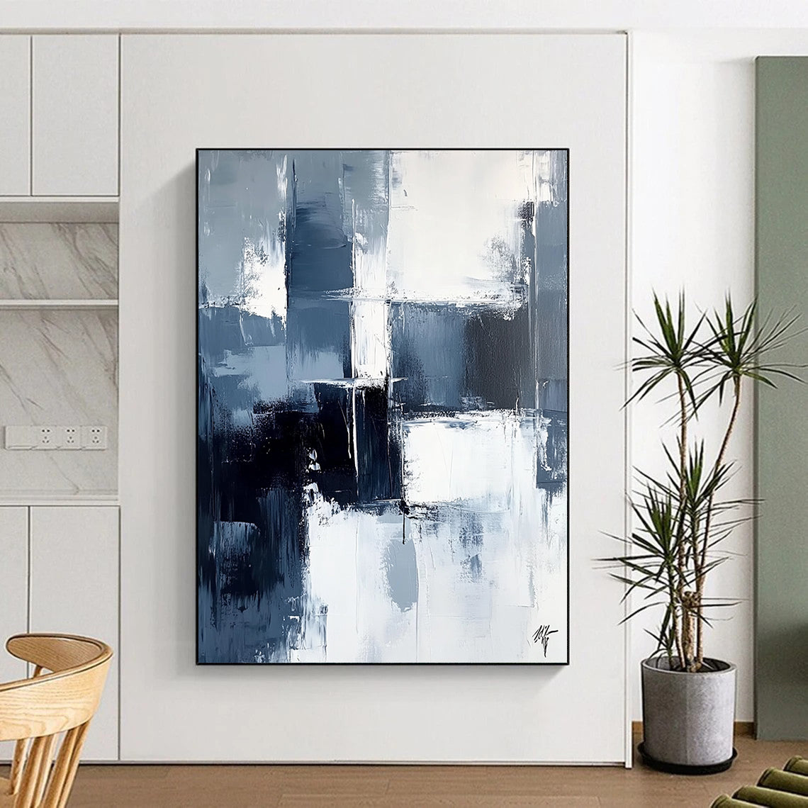 Large contemporary abstract painting featuring dark blue and white brushstrokes on a light gray background evoking calmness and simplicity. DLZ0351