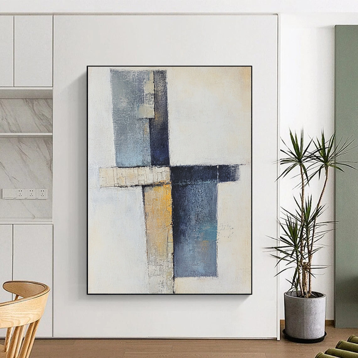 Contemporary abstract artwork showcasing a cross with soft shapes in earthy tones and blue-gray, featuring a vertical line and scattered blocks. DLZ0969