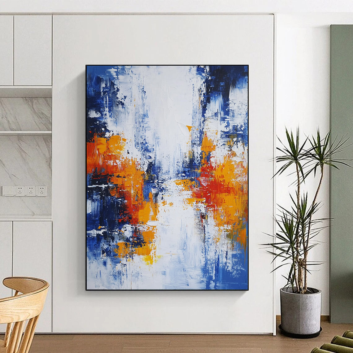 Large modern hand-painted abstract artwork featuring blue white and orange hues with broad brush strokes and thick impasto layers depicting an urban Parisian landscape. DLZ0732