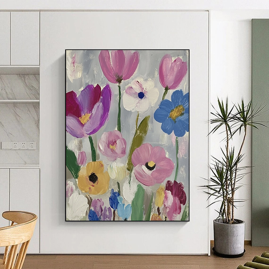 Large contemporary abstract painting featuring vibrant daisies and tulips in pink purple blue green and yellow against a soft gray backdrop with visible brush strokes. DLZ1262