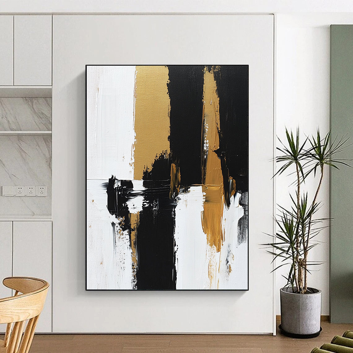 Contemporary hand-painted abstract artwork features bold brush strokes and rich textures in black, white, and gold tones on canvas. DLZ0495