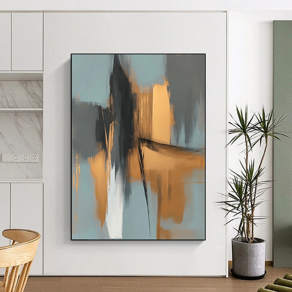 Large contemporary abstract painting features elegant gold and gray shapes against a light blue background evoking an urban landscape with serene organic forms. DLZ0706