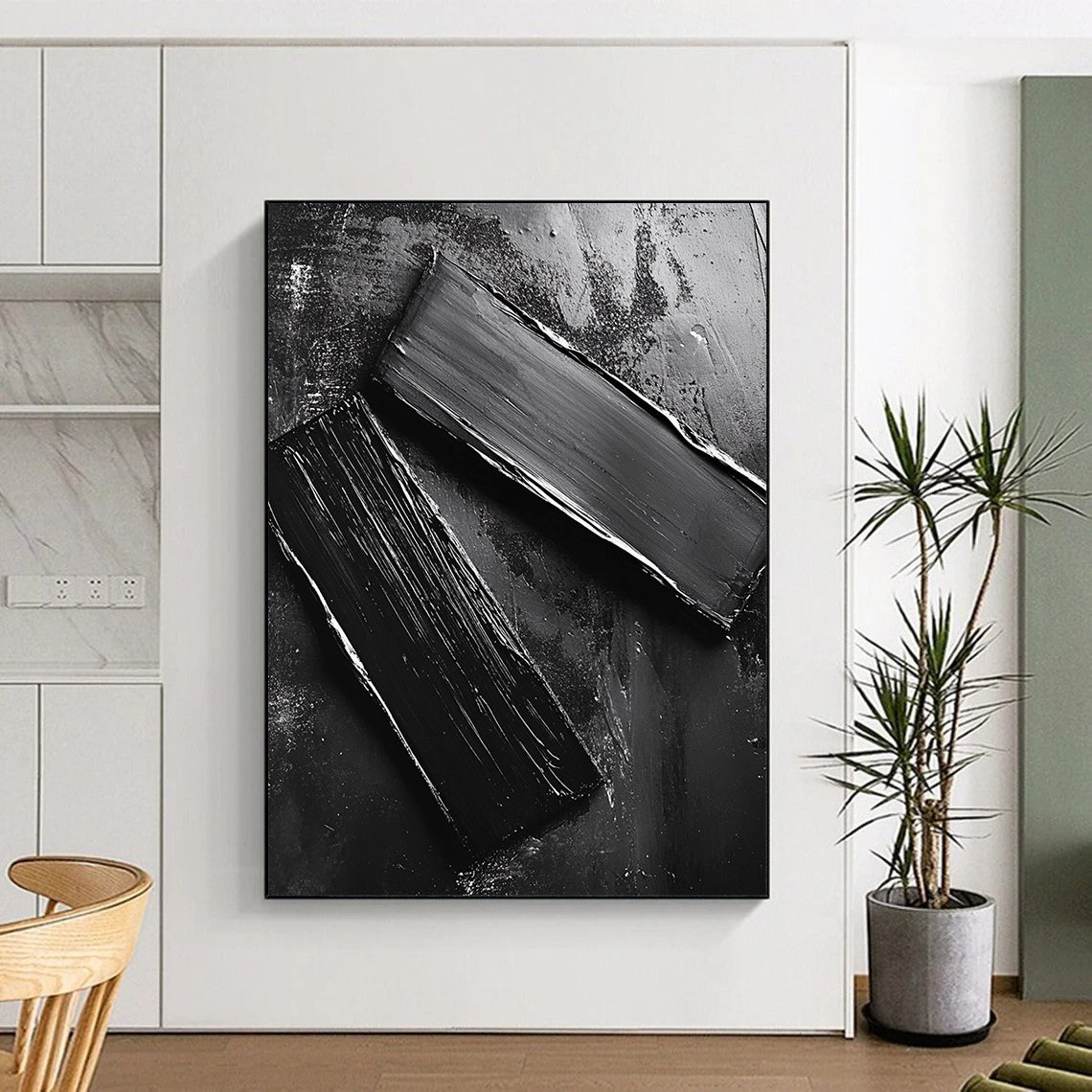 Abstract contemporary artwork featuring smooth black oil-painted metal pieces arranged on the ground reflecting mechanical elements and minimalist design. DLZ1551