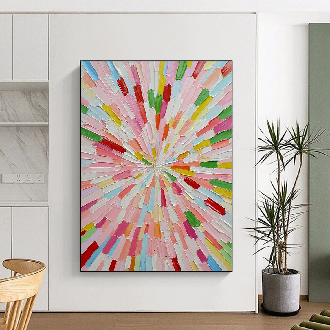 Large contemporary abstract artwork featuring vibrant colors in a sunburst pattern crafted from small paper sticks on a white background. DLZ1275