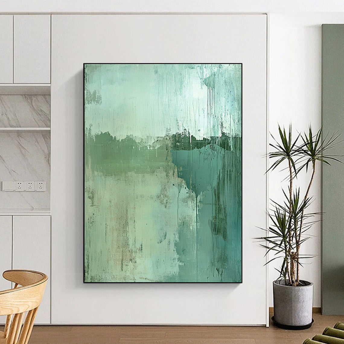 Contemporary hand-painted abstract artwork features a worn landscape in green and blue tones with textured depth and a subtle focal point for intrigue. DLZ0962