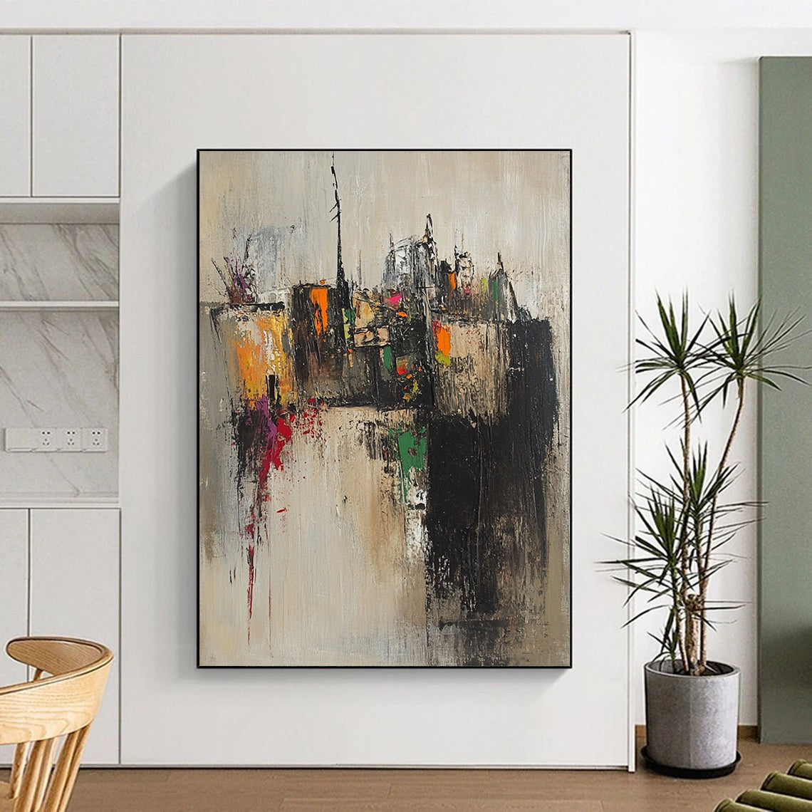 Contemporary abstract artwork featuring an old village with tight brushstrokes in muted earth tones accented by splashes of pink yellow green and orange. DLZ0959