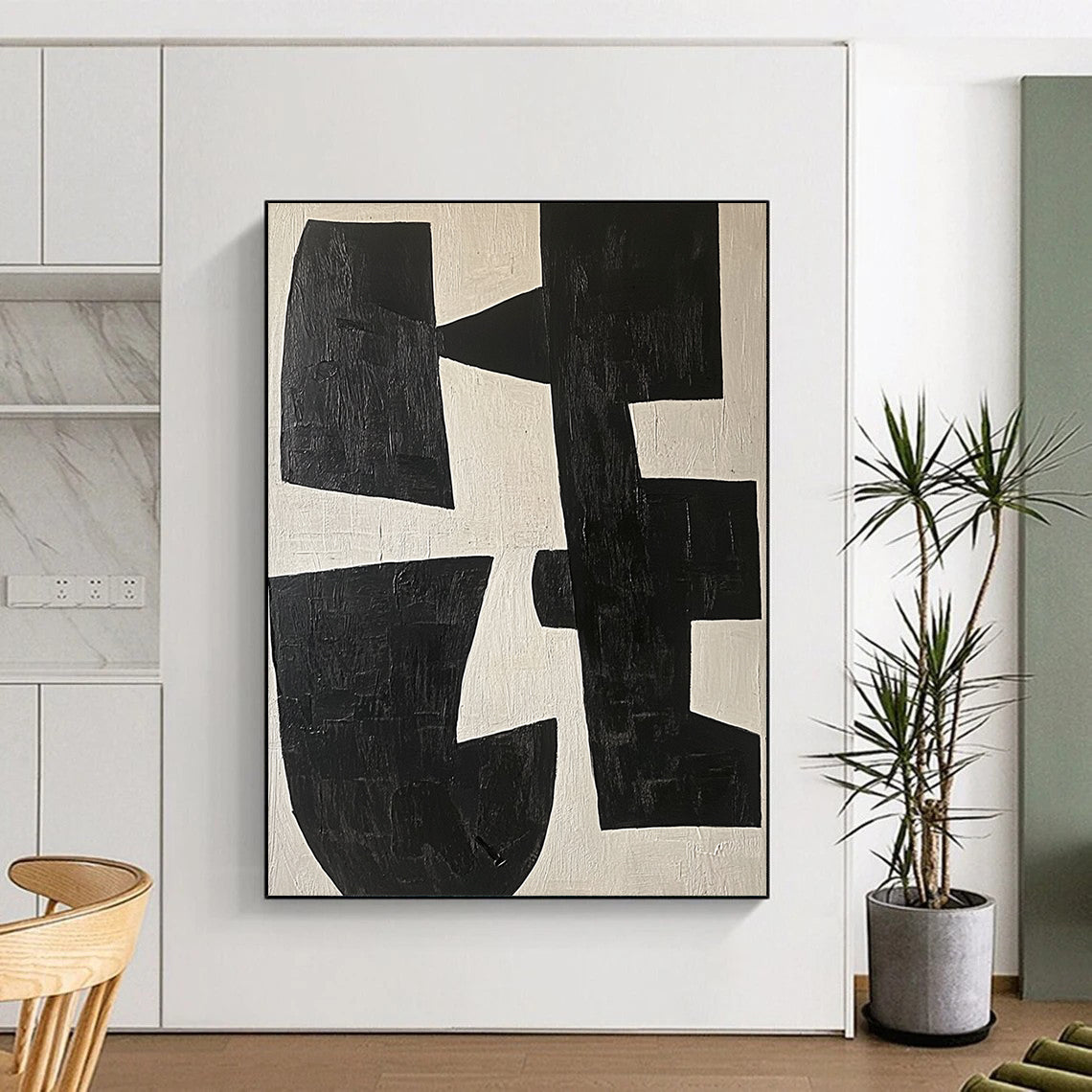 Large contemporary abstract painting featuring black and white shapes on a light beige background highlighting geometric forms and elegant movement. DLZ0509