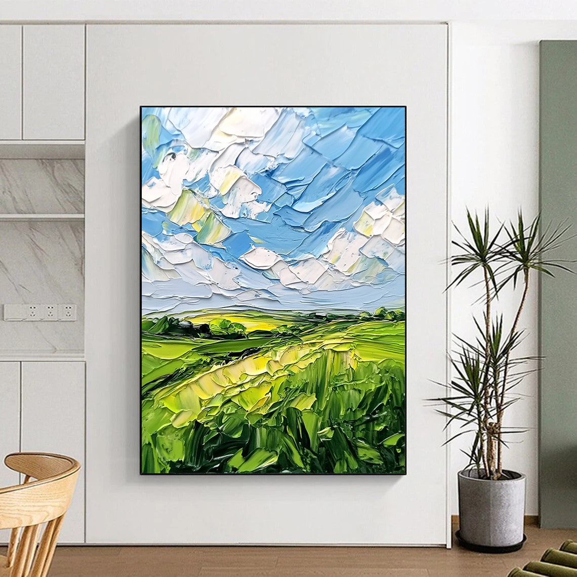 Contemporary abstract artwork featuring lush green fields and a vibrant blue sky with clouds, textured with bold impasto strokes. DLZ0484