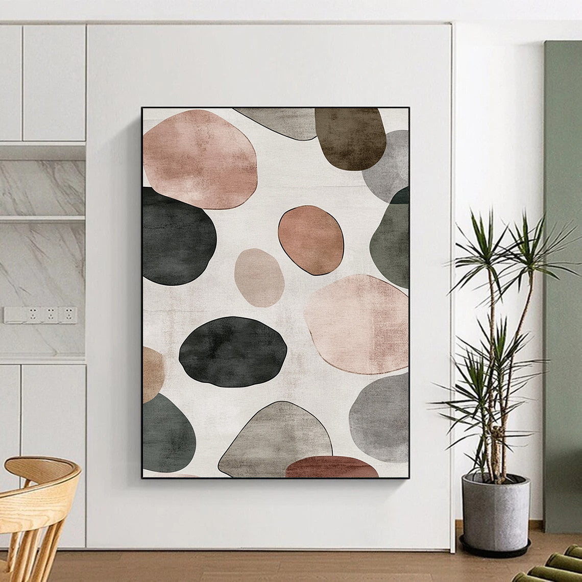 Contemporary hand-painted abstract artwork features a serene design of overlapping circles and pebbles in shades of gray with brown green and pink accents. DLZ1646