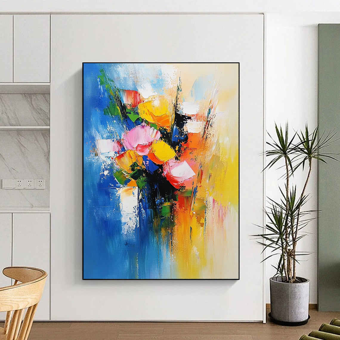 Bold contemporary abstract painting featuring vibrant flowers against soft blue and yellow tones evoking joy and vitality with dynamic brushwork. DLZ0374