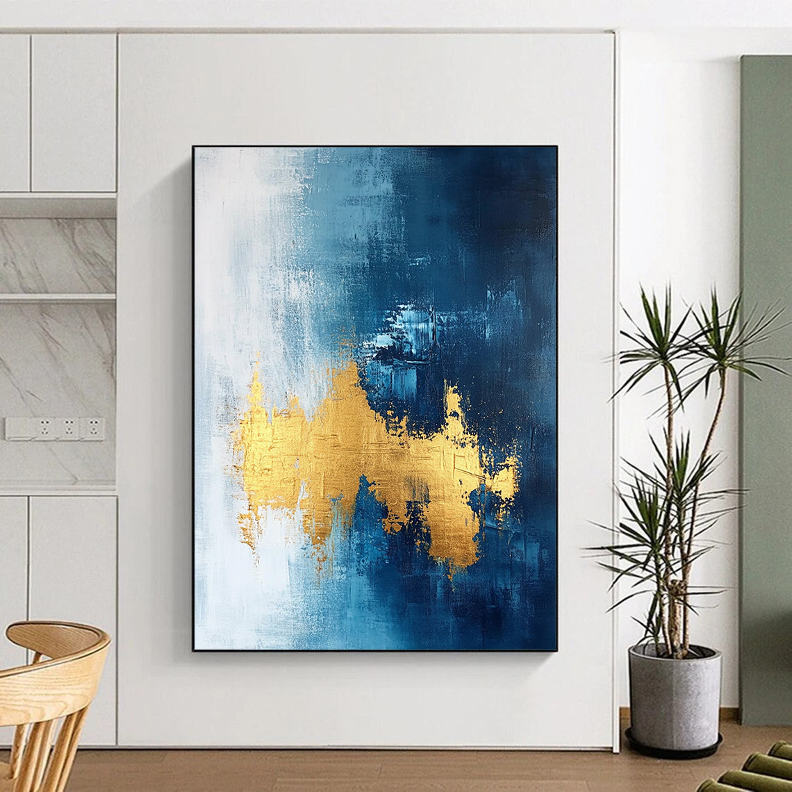 Contemporary abstract painting features gold leafing on a dark blue white and light gray background with elegant brush strokes and a sophisticated texture. DLZ0334